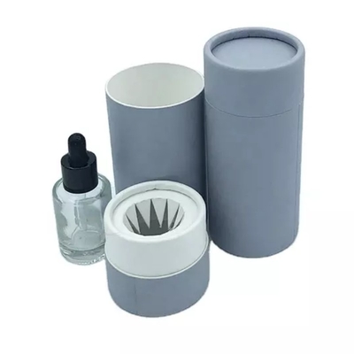 Os cartuchos cosméticos das garrafas perfumam caixas de empacotamento do cilindro com inserção de papel